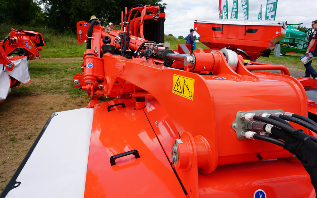 Retractable hoods on Kuhn mowers