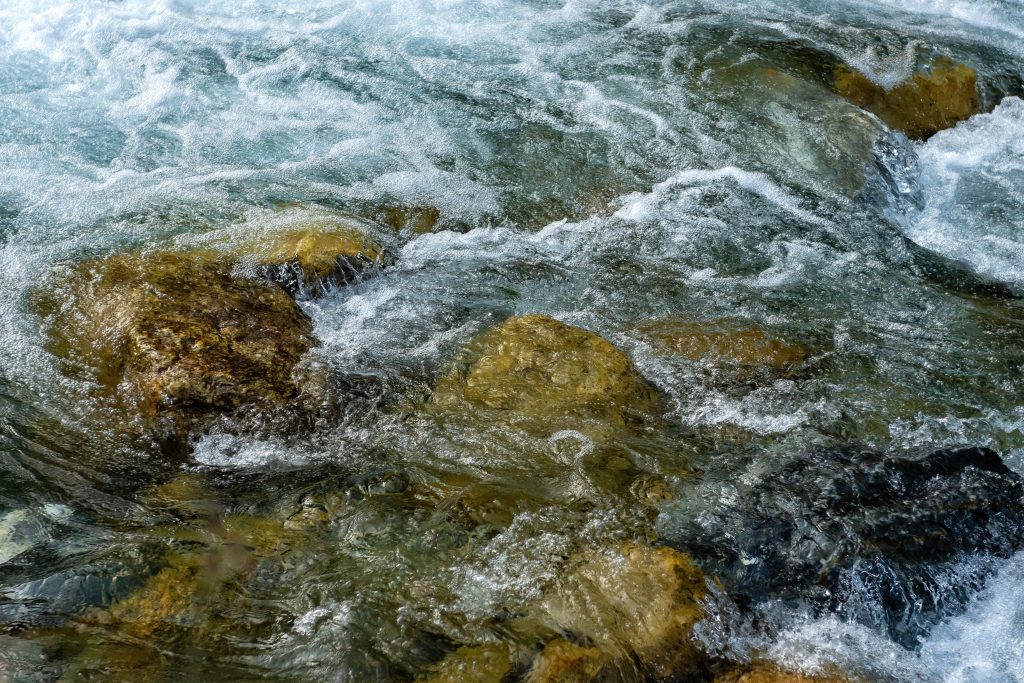Water flowing over the stones in a river