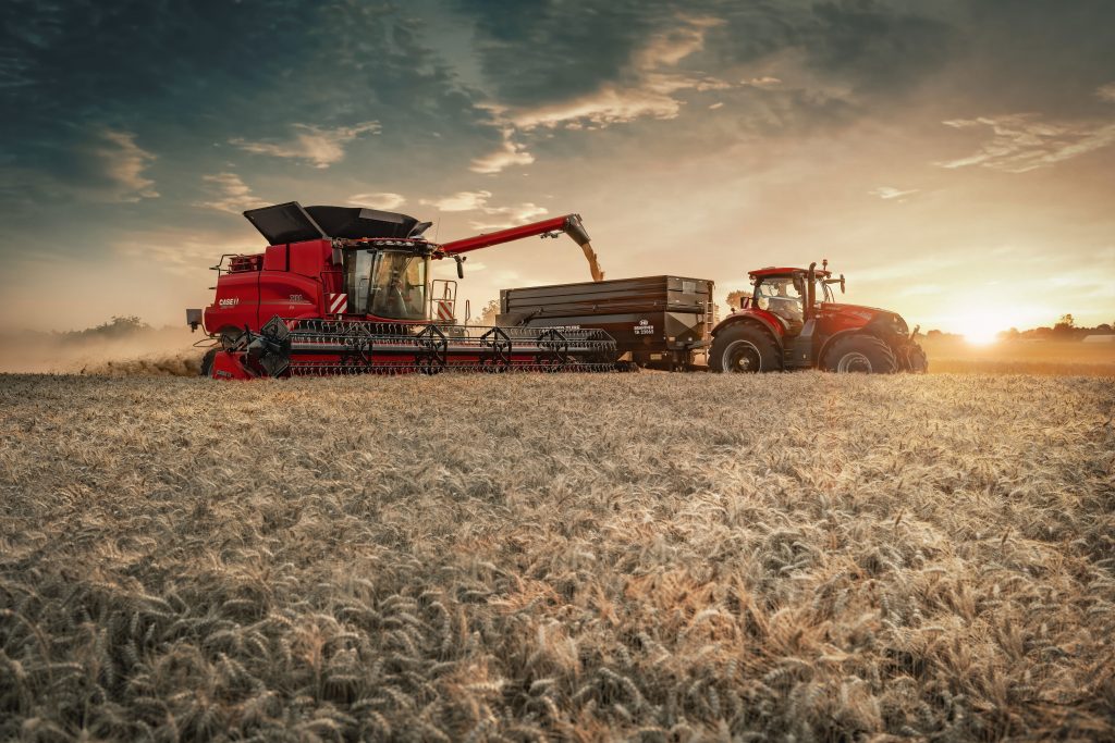 Case IH Axial-Flow 160 Model Year 2027 exterior view with tractor and grain trailer