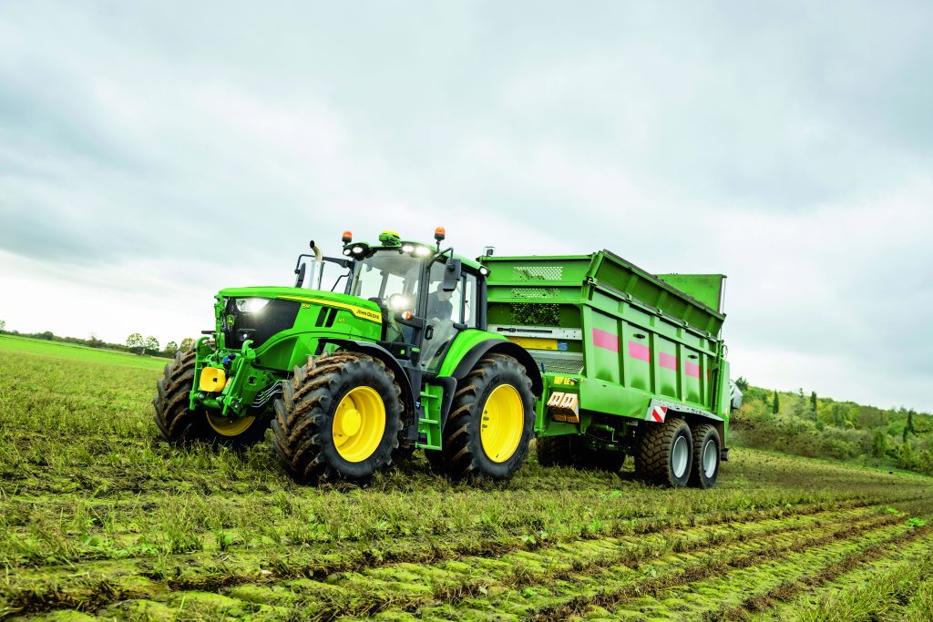 New John Deere 6M spreading dung