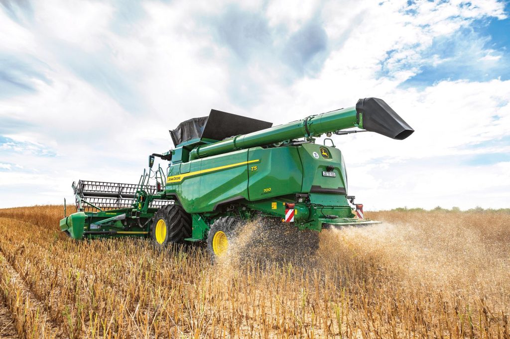 John Deere T5 combine harvester in action