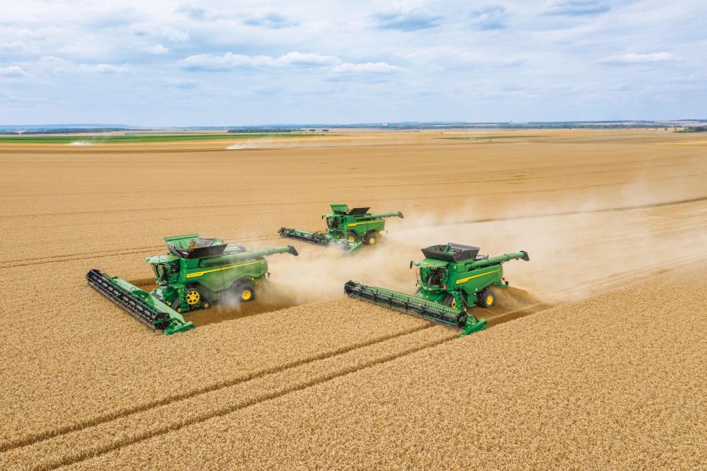 John Deere T6, S7 and X9 pictured alongside one and other at work in a field